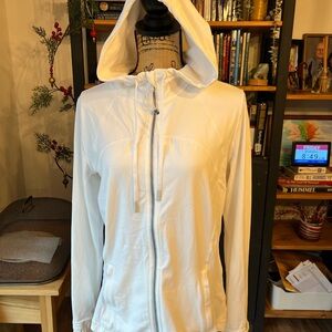This is a Lululemon Hooded Define Jacket in white Nulu fabric.